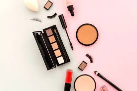 Assortment of Beauty Products on Pink Background: Treasures for Versatile Looks